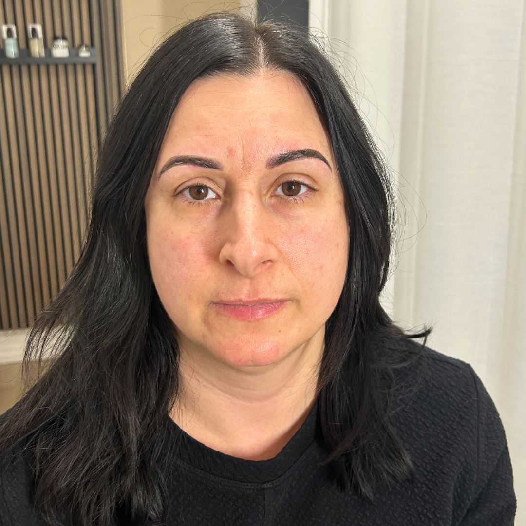 Healed powder brows on a client showing soft, natural permanent eyebrow results.