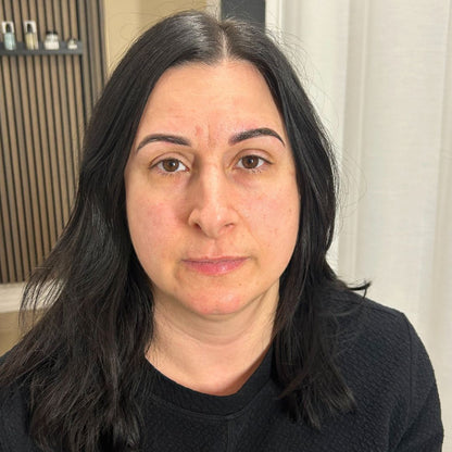 Healed powder brows on a client showing soft, natural permanent eyebrow results.
