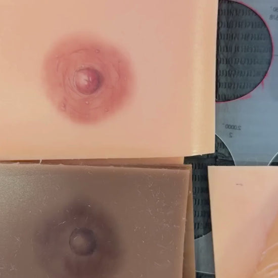 Silicone practice pads showing 3D nipple and areola tattoo designs in light and deep skin tones. These training models demonstrate shading, pigment blending, and texture techniques used in paramedical tattooing to support breast cancer survivors and women after mastectomy or reconstruction.