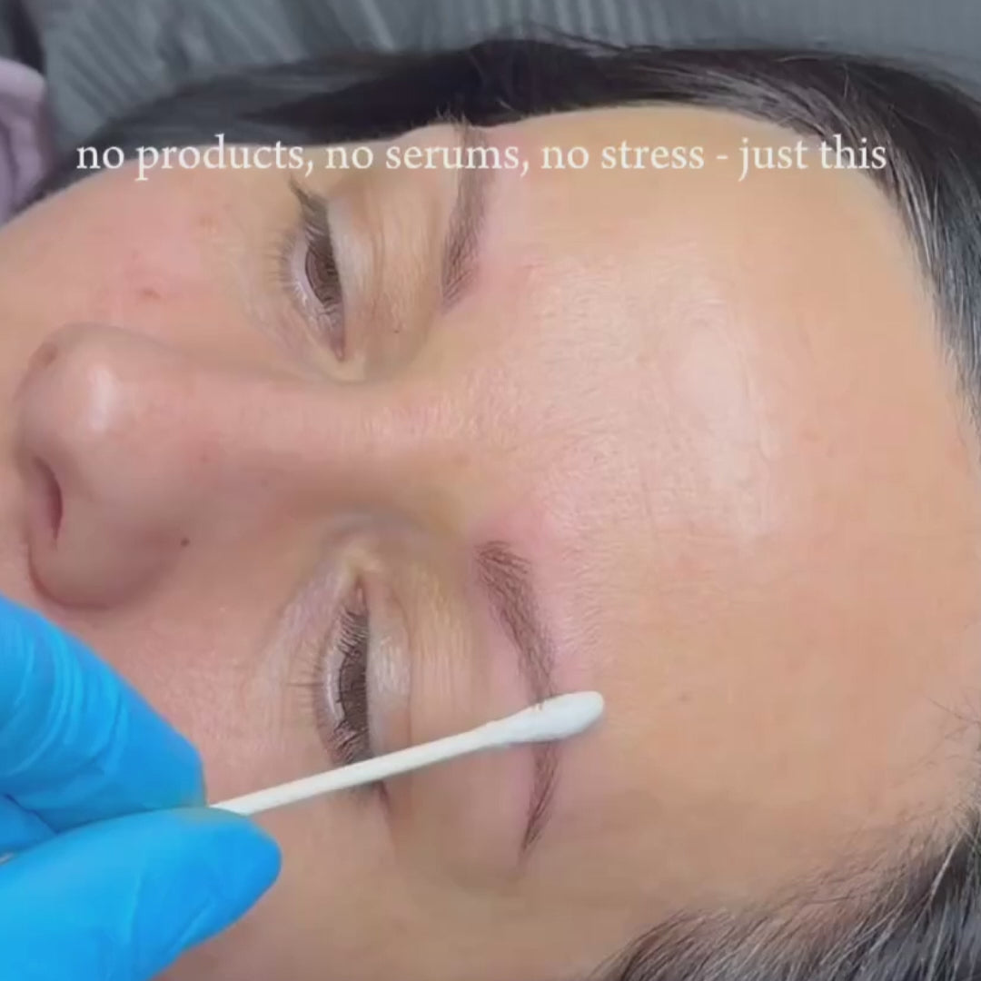 Close up of nano brow being stroked by q-tip displaying fresh brows. Service performed at SKN Deep Cosmetic Clinic in Grimsby.