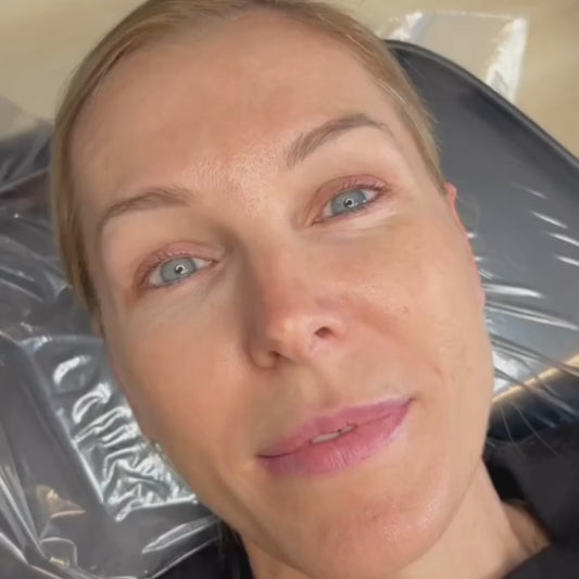 Before and after of natural permanent eyeliner tattoo on blonde woman with hooded eyes. The before shows natural eyelids with no makeup; the after shows healed black liner with a gentle wing.